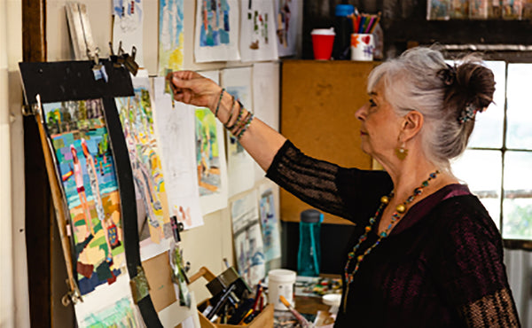 Artist Joan Harris working in her studio.