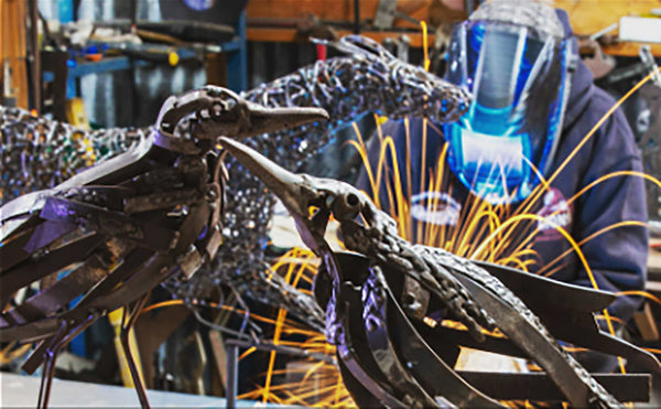 Sculptor Yvonne George welding a sculpture at Village of Artisans, Bendigo Pottery.